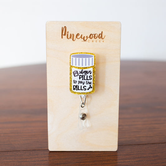 Slingin Pills To Pay The Bills Bottle Badge Reel