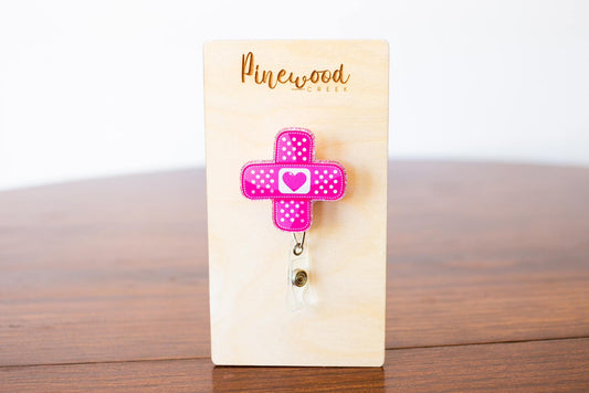 Pink Bandaid Badge Reel