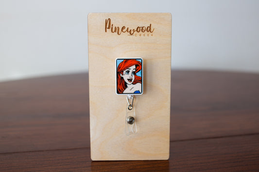 Ariel Comic Book Square Badge Reel